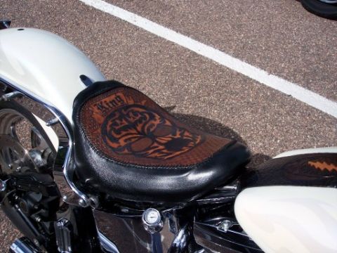 1972 Ford Ranchero - A custom motorcycle seat features intricate tooling with the word "King" and a skull design.
