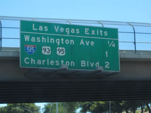 1990 Ford Bronco - green overhead highway sign reads Las Vegas Exits for Washington Ave, I-515, US 93/95 and Charleston Blvd.