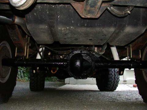 1996 Ford Bronco - The initial application of POR15 Rust Inhibitor to the rear end. Talk about glossy. I am prepping to put on the *Chassis Coat Black* which…