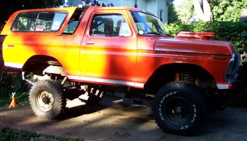 1978 Ford Bronco - This modified Ford Bronco sits high on off-road tires, a prominent hood scoop and custom paint.