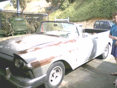 1957 Ford Ranchero - This 1957 Ford Ranchero pickup truck shows significant rust and primer paint.