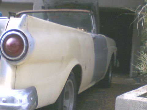 1957 Ford Ranchero - This convertible's distinctive tail fin and taillight suggest a mid-1950s model, possibly a Ford Fairlane.