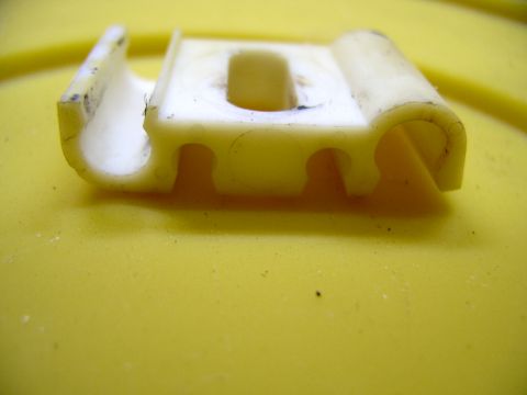 1990 Lincoln Town Car - Another view of the clip. The two inner grooves take the brake lines and the outers take the fuel and vapour return lines.