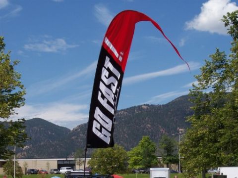 1972 Ford Ranchero - A large flag with 'GO FAST!' text flies against a backdrop of mountains and a blue sky.