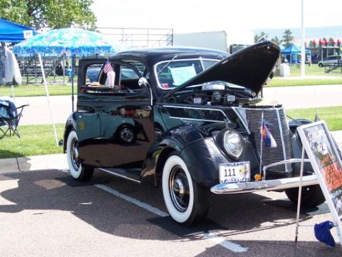 1972 Ford Ranchero - This 1937 Ford Coupe is displayed with its hood open, revealing the engine bay.