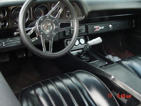 1997 Ford Probe - Interior of a Chevrolet Camaro Z28, bucket seats and a distinctive Z28 badge on the dashboard.