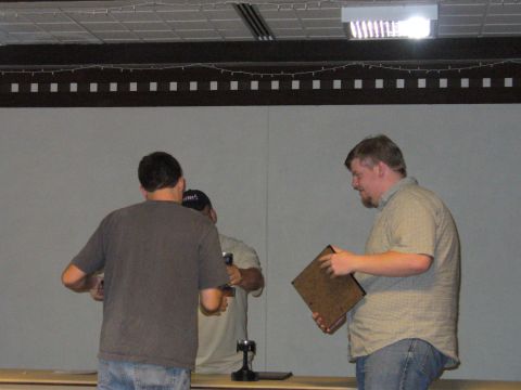 1991 Ford Probe - A man accepts a plaque from another person at an indoor event.