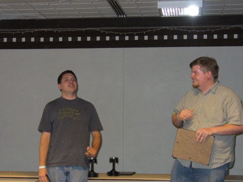 1991 Ford Probe - Two men are standing in front of a plain wall indoors, with one man speaking and the other holding a clipboard.