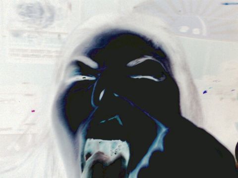 2001 Ford Crown Victoria - This image shows a person's face with an inverted color scheme, appearing to scream.
