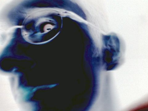 2001 Ford Crown Victoria - A close-up, inverted image shows a person's profile with glasses, with a watermark at the bottom right.