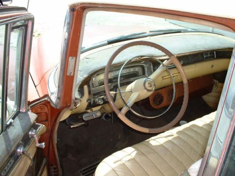 1972 Ford Ranchero - The interior of a classic car shows a two-tone steering wheel and tan upholstery.