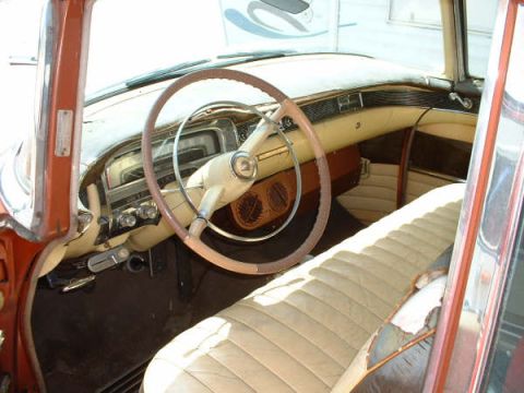 1972 Ford Ranchero - Interior view of a classic car with a two-tone steering wheel and beige seats.