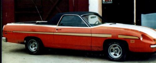 1972 Ford Ranchero with orange body, white hood stripe, and black vinyl top