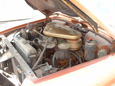 1972 Ford Ranchero - Close-up view of an older car's engine compartment, showing the radiator and air cleaner assembly.
