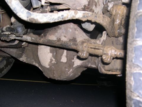 1994 Ford Bronco - You can't tell too much but this is my front differential caked and filled with mud and getting high centered and getting dragged out as I…