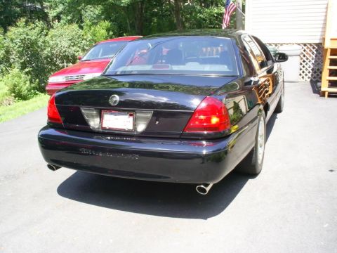 2003 Mercury Marauder - Rear view of a black 2003 Mercury Marauder with dual exhaust pipes.