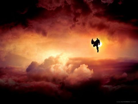 1993 Ford Bronco - Superman flies through a fiery sky, silhouetted against the sun.