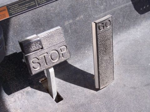 1972 Ford Ranchero - Close-up of the stop and go pedals on a golf cart, with visible text labels.