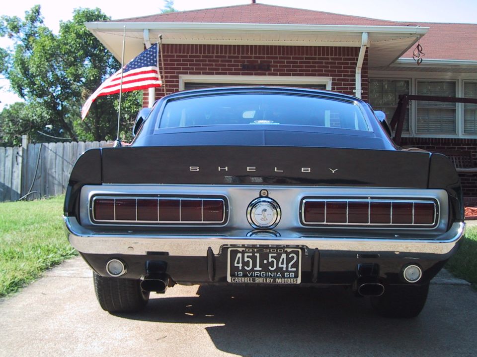 Rear of a dark 1968 Shelby fastback with SHELBY lettering, Cobra badge and Virginia plate