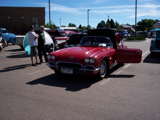 Red convertible with door open, license plate 327-HKY