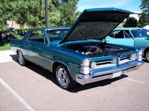 1964 Pontiac Grand Prix with hood open, another car behind it
