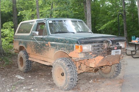 1990 Ford Bronco - One muddy truck with one shiny new hub.