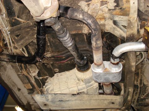 1994 Ford Bronco - Underside view shows exhaust system, transfer case, and driveshaft components.