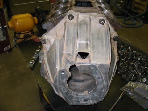 1993 Ford Taurus - Engine block and transmission bell housing assembly on a workbench, with tools and parts in the background.