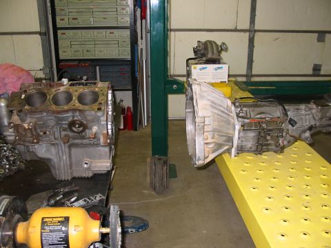 1993 Ford Taurus - Engine block and transmission components are visible in a workshop setting.