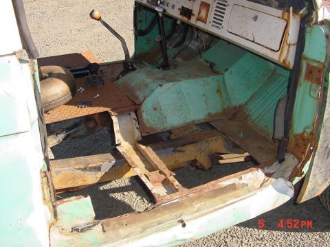 1991 Ford Explorer - Interior view of a heavily rusted classic vehicle, revealing extensive corrosion on the floor and structural components.