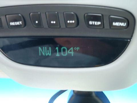 1995 Ford Bronco - Vehicle's overhead console displays temperature and compass direction.