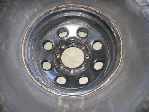 1994 Ford Bronco - Close-up of a wheel and tire assembly, likely from an off-road vehicle.