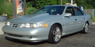 1993 Ford Taurus - Cowl hood and new wheels.
