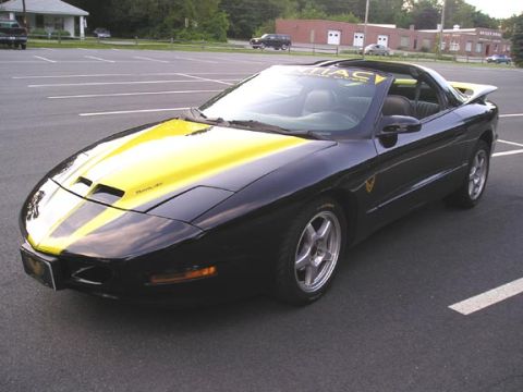 1984 Pontiac Fiero - This black and yellow Pontiac Trans Am has racing stripes and a spoiler.