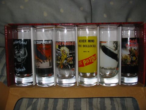 1997 Ford Crown Victoria - A set of six shot glasses displaying iconic artwork and logos from various rock bands.