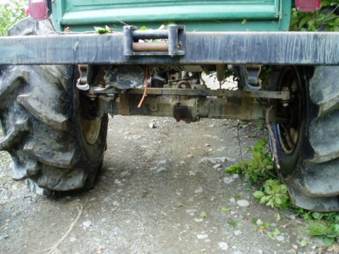 2000 Ford E350 - Close-up of a truck's rear axle and tires, showing a winch on the bumper.