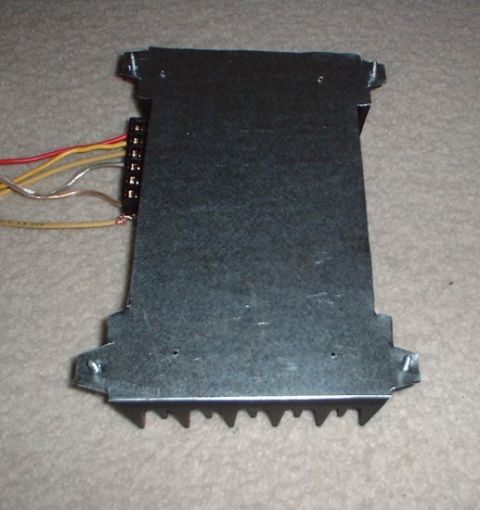 1993 Ford Taurus - new amp mounted to braket. note old amp mounting holes.