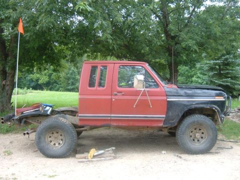 1985 Ford F-150 - This is a Ford F-Series truck cab and chassis, likely from the early 1980s, with an extended cab and large tires.