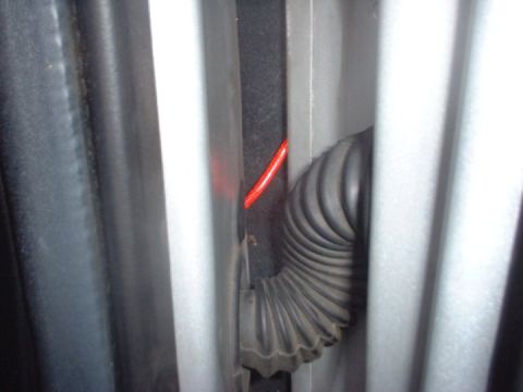1993 Ford Taurus - Amp wire running through rubber plug in door jam
