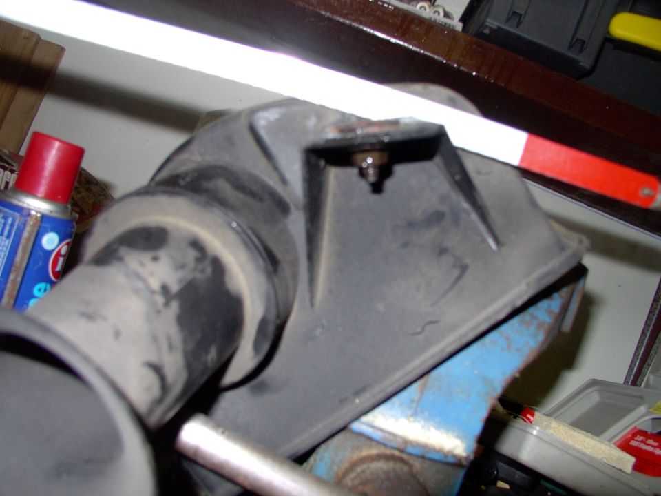 Sawing off the isolator mount tab is neither rocket science or difficult.