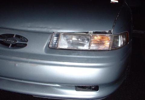 1993 Ford Taurus - new headlight housing and turn signal. old hood.