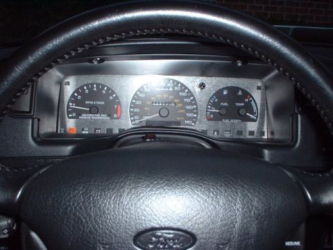 1993 Ford Taurus - Speedhut brushed aluminum guage overlay.