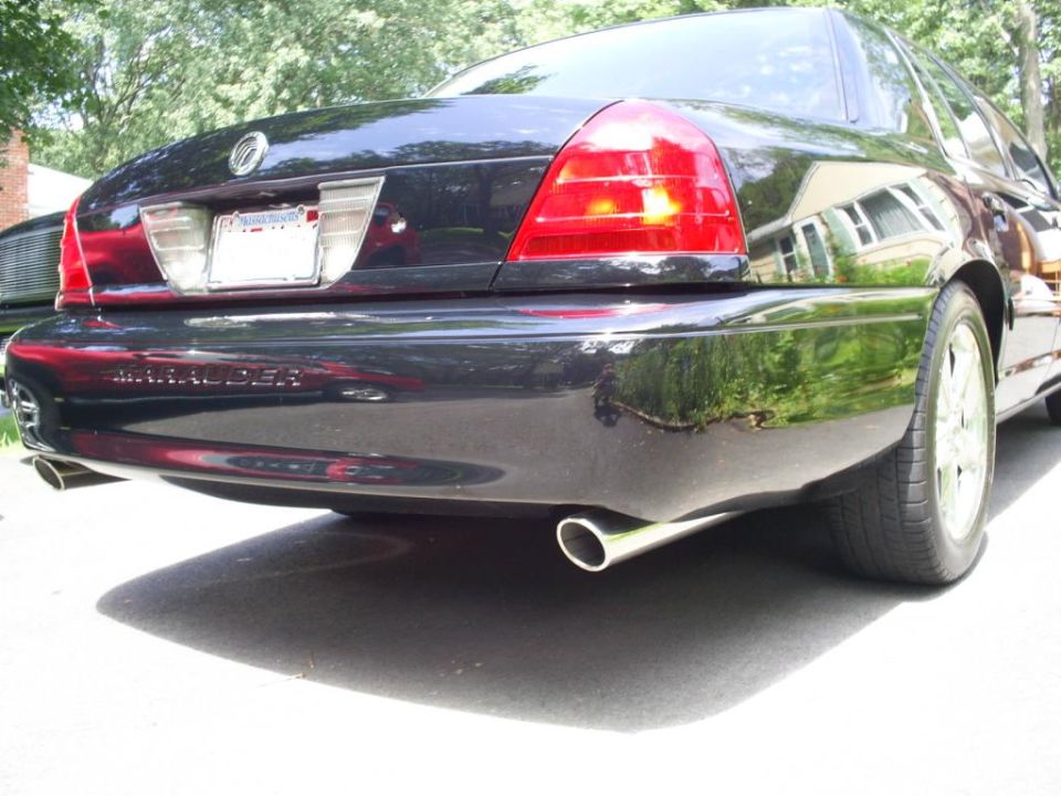 Black 2003 Mercury Marauder rear quarter view with dual exhaust pipes