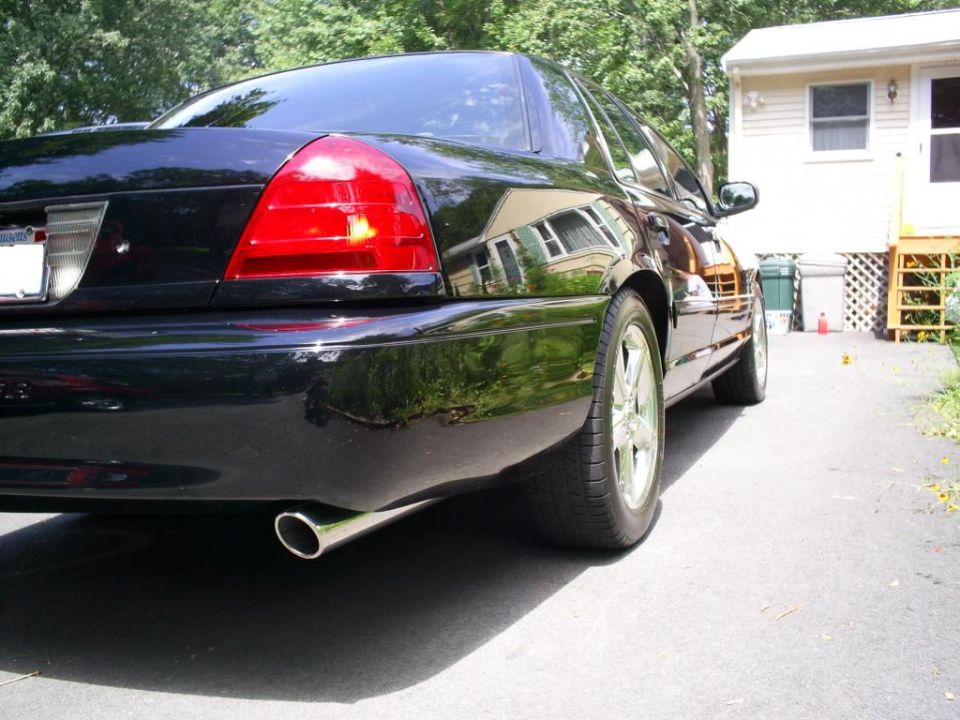 2003 Mercury Marauder rear quarter view, black paint, chrome exhaust tip