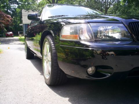 2003 Mercury Marauder - Front quarter view of a black 2003 Mercury Marauder with chrome wheels.