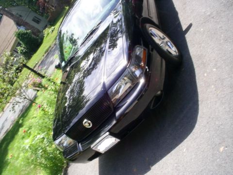 2003 Mercury Marauder - Front view of a black 2003 Mercury Marauder, highlighting its distinctive grille and headlights.