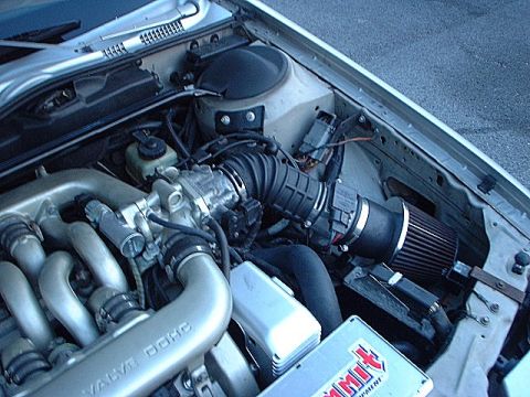 1993 Ford Taurus - Shot of dirty engine, 73mm Mass air meter, K&N conical filter, and strut bar.