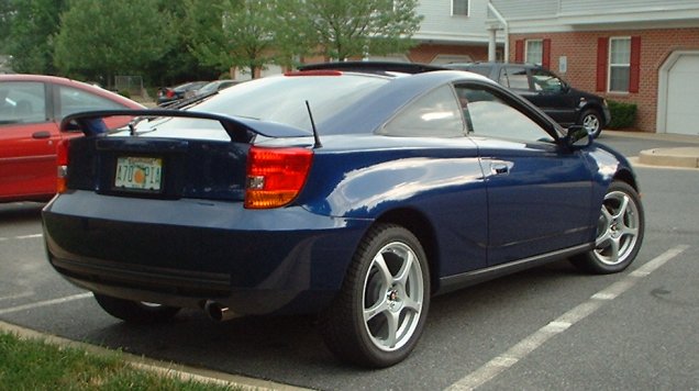 Blue Toyota Celica coupe rear three-quarter view in a parking lot