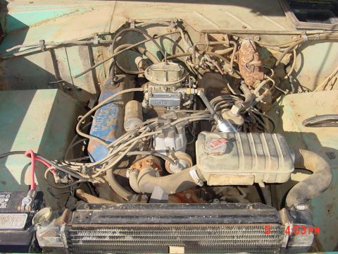 1991 Ford Explorer - Close-up of a V8 engine bay, showing the carburetor and radiator components.