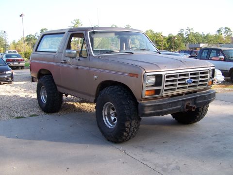 1981 Ford Bronco - This 1978 Ford Bronco is shown from the front-left, equipped with large off-road tires and an aftermarket bumper.